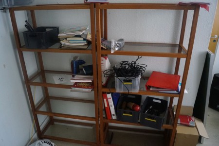 Shelf with various microphones, songbooks, bells etc.