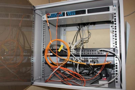 Customer-premises distributing frame with 2 switch boxes, power cable + fiber box