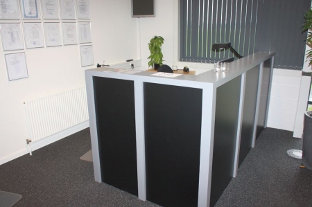 Reception Desk + electric sit / stand desk + drawer + shelving. All without content. PC and phone not included
