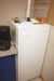 Gram refrigerator + Krups coffee machine + cabinet with contents.