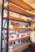 1 section heavy steel rack with 12 beams including content various Paint + disposable suits, etc.