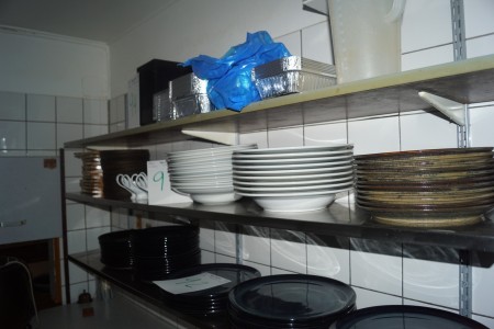 Various serving dishes etc. on the shelf.