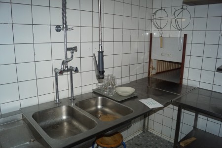 Stainless wall hung table with sink.