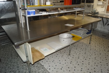 Stainless steel freestanding table 122x275 cm without contents.