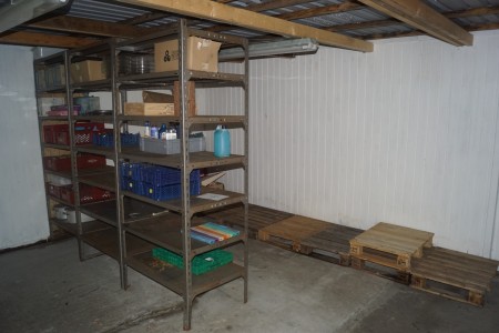 Contents in the back room steel shelves with content half pallets etc.