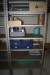 Contents in the back room steel shelves with content half pallets etc.