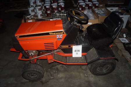 Garden tractor, brand westwood, model ti200, 12 hp starts with large traction, note rocks missing