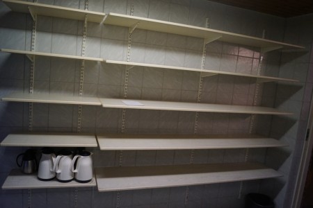 Shelving system hung on wall.