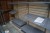 Shelving system, wooden back plate, shelves in iron. Height: 148cm, Width: 302cm, Depth: 98cm.