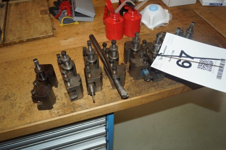Various lathe holders with various plate holders fitted.