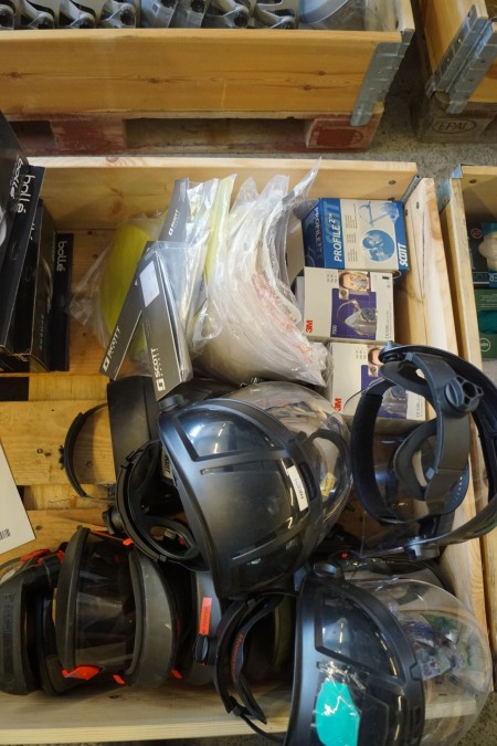 Lot of fresh air masks with plastic screens for helmets.