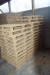 Large lot of particleboard + disposable pallets