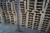 Large lot of particleboard + disposable pallets