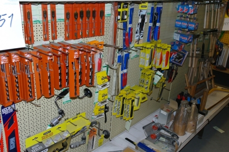 3 section shelves with tool hooks containing drills + planing + box cutters + hammers + blades, etc.