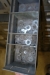Rack with assortment boxes containing, among other things drills (20 mm to 45 mm), screws, bolts, nuts.