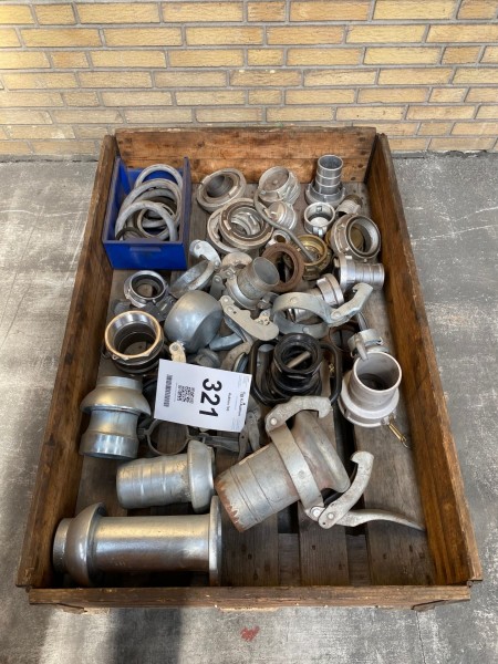 Lot of irrigation couplings, oil couplings and steel wheels for harrow