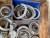 Lot of irrigation couplings, oil couplings and steel wheels for harrow