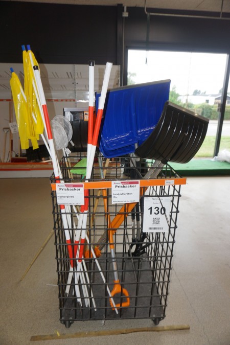 Exhibition trolley on wheels containing barrier poles, snow shovels, etc.