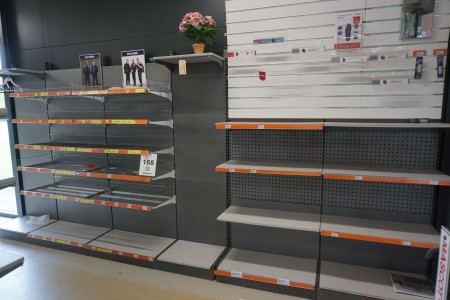 Exhibition shelf with perforated plates and shelves for wall.