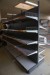 Exhibition shelf with perforated plates and shelves