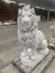 Large seated lion, cast white concrete