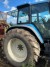 Tractor, Brand: New Holland, Model 8560. With Quicke front loader Model: Q75.