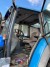 Tractor, Brand: New Holland, Model 8560. With Quicke front loader Model: Q75.