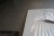 Bordplade, 61x303 cm, lys granit, med div kantbånd. Har lille brændemærke på ende se foto
