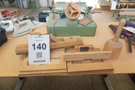 Wood planer, hammer and buckles.