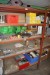 Contents in 1 subject bookcase of various filters, fluorescent tubes, work lamps, spare parts, etc.