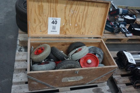 Wooden box containing various wheels