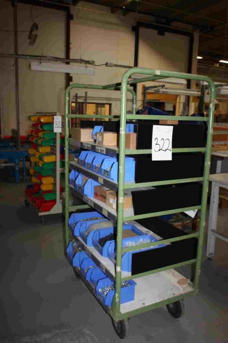 Transport carts with assortment racks with content: screws, washers, etc.