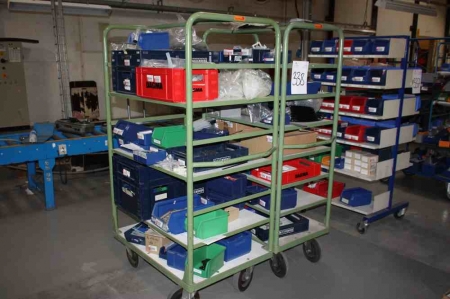 2 trolleys with content: electric parts, plastic tubing, springs, etc.