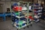 2 trolleys with content: electric parts, plastic tubing, springs, etc.