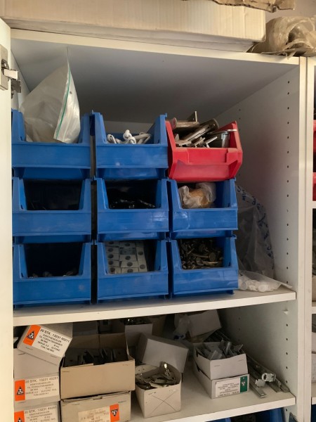 Content in 2 pcs. cabinets of various bolts, fittings, nails, etc.