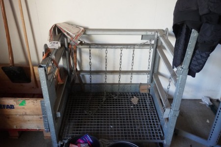 Metal cage for welding bottles.