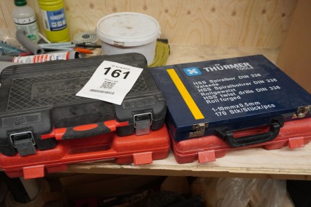 2 pcs. power tools, brand: Makita + 4 boxes with tools