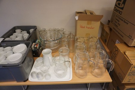 Large batch of jugs in glass