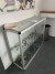 Glass chest of drawers with contents