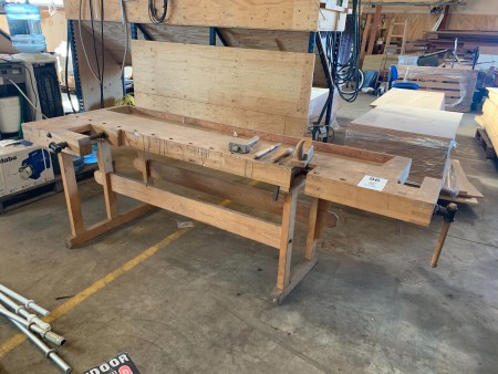 Wooden planing bench with tools