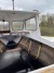 Wooden boat coated with fiberglass
