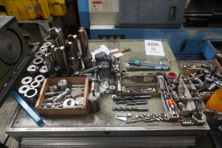 Contents on top of cabinet of various tool holders, plate holders, etc.