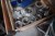 3 pallets containing various turning heads, flanges, machine parts, etc.
