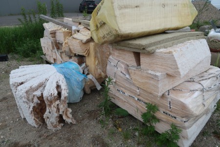 2 pallets with insulation, standing outside,
