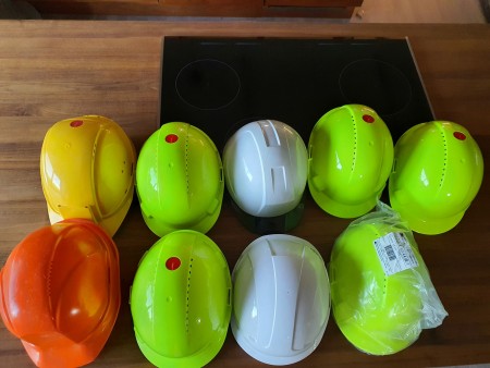 9 safety helmets, some new, others used a few times