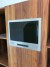 Cabinets made of solid walnut with draft beer system and flat screen.