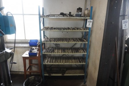 Steel shelf containing various drills