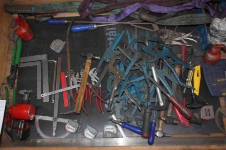 Pallet with various hand tools, pliers, lifting straps, etc.