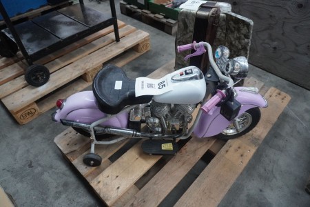 Toy motorcycle on el