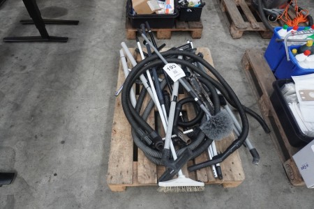 Pallet with vacuum hoses and lances etc.